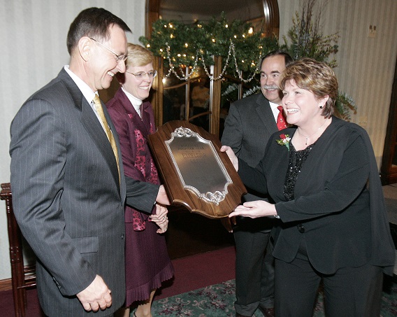 JOHN F. ELBERS II | ROCKFORD REGISTER STAR Carpenter?s Place interim executive director Kay Larrick and Al Barsema accept the 2007 Excelsior Award Thursday at Cliffbreakers in Rockford. Cathy Barsema and Rockford Register Star publisher Fritz Jacobi joined the presentation.